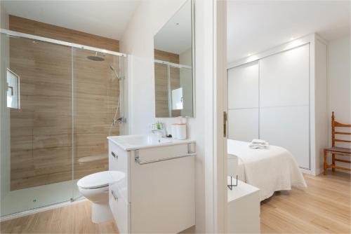 a bathroom with a toilet and a sink and a shower at Ca na Menuda in Sencelles