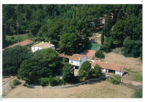 an aerial view of a house in a forest at Masia Rural Les Alsines in Valls