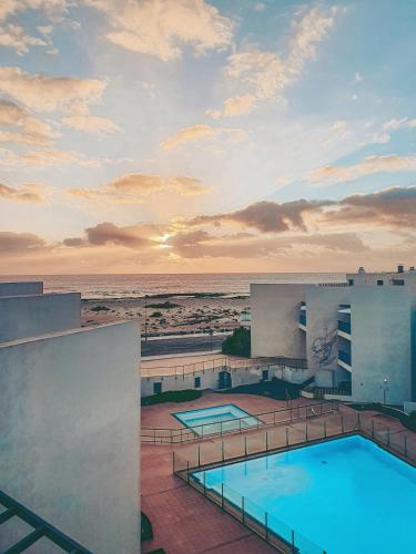 a view of the ocean from the balcony of a hotel at Casa Aloe Vera in El Cotillo
