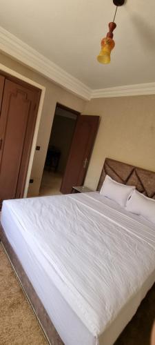 Katil atau katil-katil dalam bilik di Hotel Beach Club la Perle
