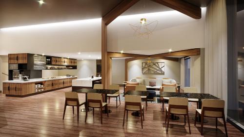 a kitchen and dining room with a table and chairs at Marriott Springfield Downtown in Springfield