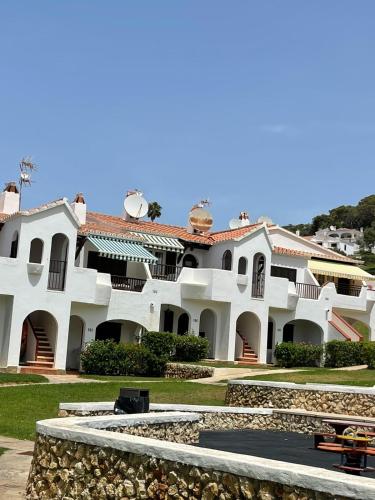 a large white building with a pathway in front of it at Casa Peña en Son Bou in Son Bou