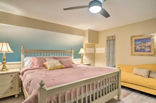 a bedroom with a large bed and a couch at Sunny North Fort Meyers Escape with Canal Views! in North Fort Myers
