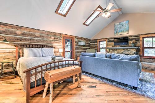 a bedroom with a bed and a couch at Cozy Mama Bear Cabin with Mountain Views! in Clyde