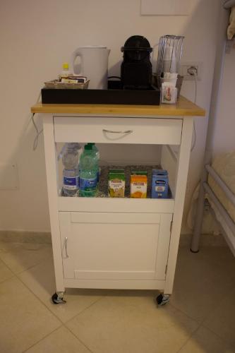 a white table with a counter top on top at Ostello Villafranca in Pignola