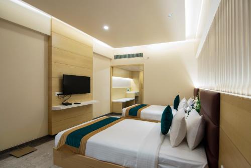 Zion - A Luxurious Hotelにあるテレビまたはエンターテインメントセンター