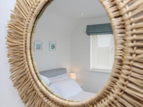 a mirror reflection of a bed in a room at Marazion Attic in Marazion