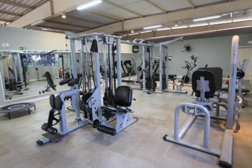 a gym with several tread machines in a room at Hotel Premium Campinas in Campinas