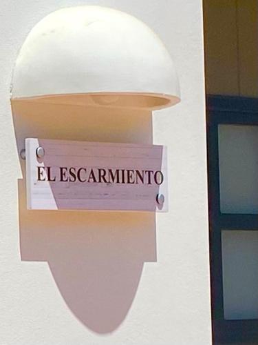 a sign on the side of a building with the word eleganceinion at Apartamento para pareja, Finca Contrabando. Sanlucar del Guadiana in Sanlúcar de Guadiana