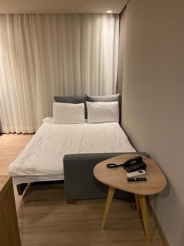 En eller flere senge i et værelse på Golden Gramado Resort Temporada