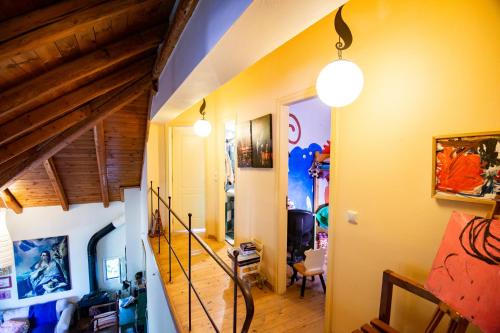 a hallway with a staircase in a house at CRETAN ROOTS HOME in Kokkíni Khánion