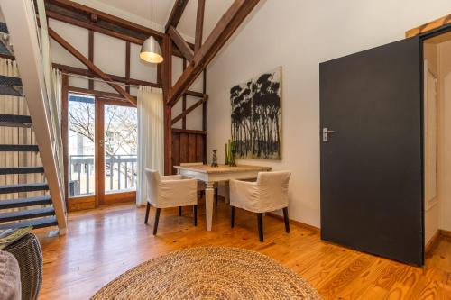 a dining room with a table and chairs at The Lofts Boutique Hotel in Knysna