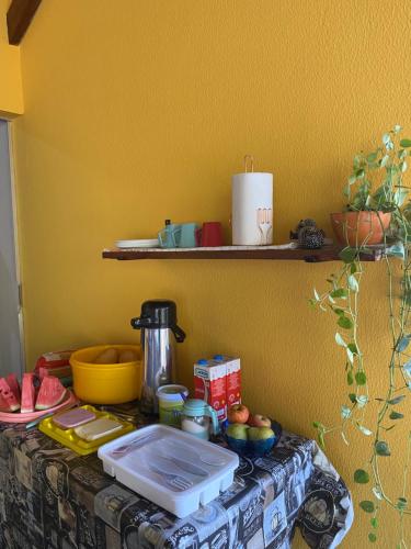 a table with a counter top with food on it at POUSADA LAR DA JOSÉFA in Estivado