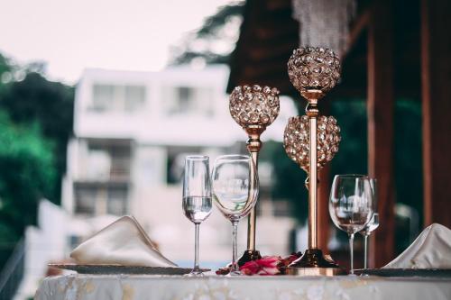 a group of wine glasses sitting on top of a table at Equinoccio Hotel in Santa Ana