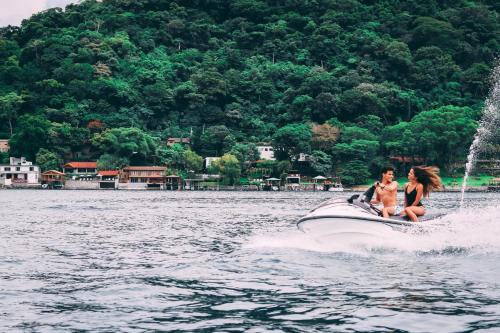 two people on a jet ski in the water at Equinoccio Hotel in Santa Ana