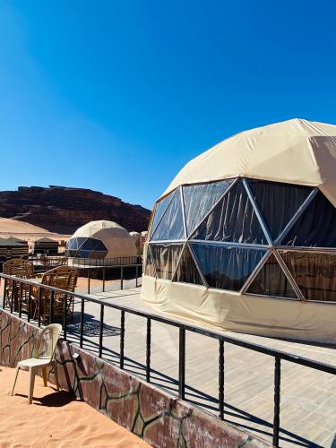 a domed building with a chair in front of it at wadi rum land mars in Wadi Rum