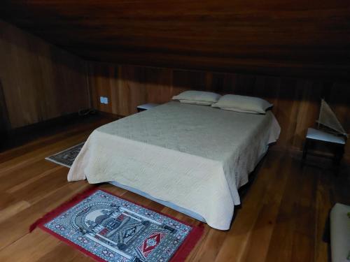 Ένα ή περισσότερα κρεβάτια σε δωμάτιο στο Lumiar Eco Lodge - Casa Alemã