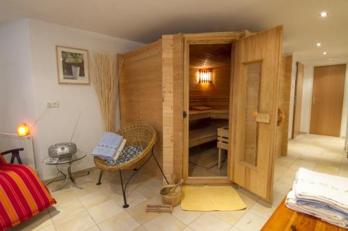 a room with a closet with a desk and a chair at Appartements Erhol dich gut in Leutasch