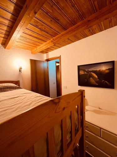 Кровать или кровати в номере Chalet Blanc "Coeur Sapin"