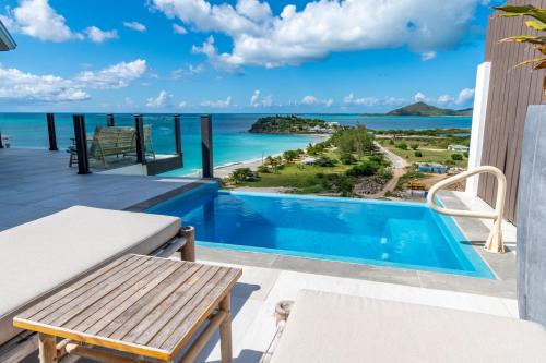 a view from the balcony of a villa with a swimming pool at Tamarind Hills Resort & Villas in Johnsons Point