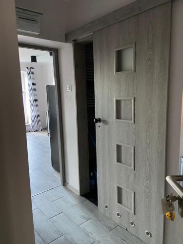 an open door in a room with a hallway at Apartamenty Bezrzecze in Szczecin