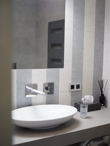 a bathroom with a large white sink on a counter at Apartman Grey in Prague