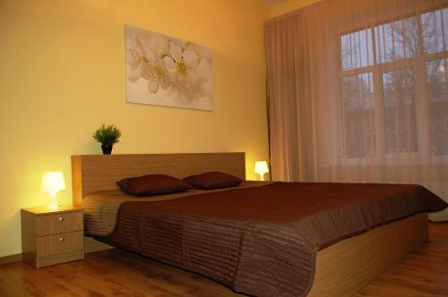 מיטה או מיטות בחדר ב-Valdemaras Apartment 91