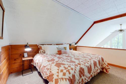 a bedroom with a bed and a large window at Riverbend in Bartlett