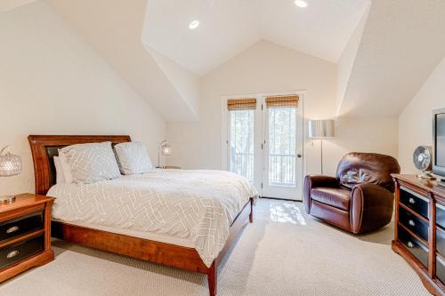 a bedroom with a bed and a chair at Cobble Creek Pearl in Driggs