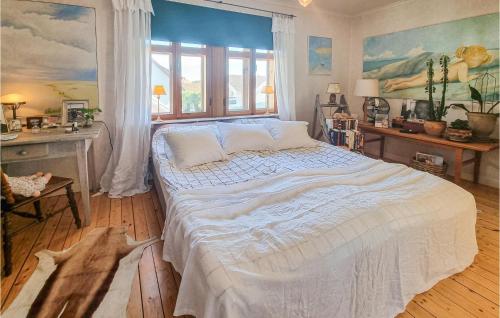 a bedroom with a large bed in a room at Awesome Apartment In Skrhamn With Kitchen in Skärhamn