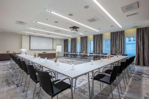 a large conference room with a long table and chairs at Palace Hotel Tallinn, a member of Radisson Individuals in Tallinn