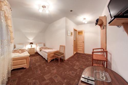 Un pat sau paturi într-o cameră la Pektoral