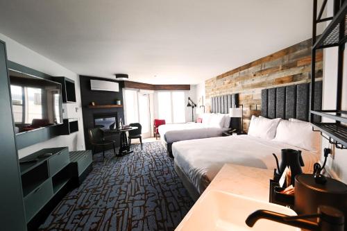 a hotel room with two beds and a sink at Cannery Pier Hotel & Spa in Astoria, Oregon