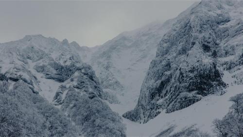 a snowy mountain range with snow covered mountains at Soukyu 蒼穹 #TB1 in Yonago
