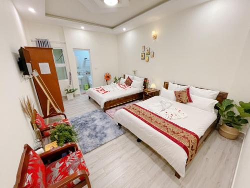 Postel nebo postele na pokoji v ubytování Moc Nhien Hostel Da Lat