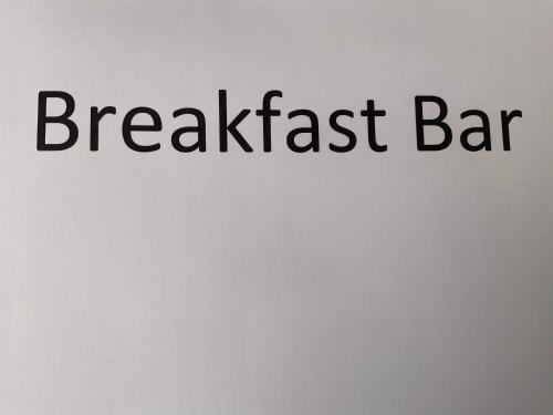 a sign with the words breakfast bar on a wall at Argyle Accommodation in Hobart