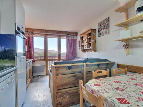 Studio cabine pour 4 au pied des pistes avec balcon