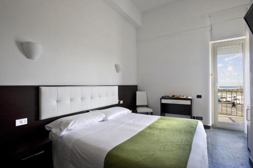 Letto o letti in una camera di Dipendenza Hotel Bellavista