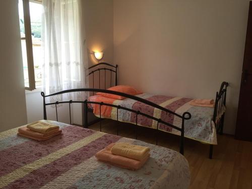 a bedroom with two bunk beds with towels on them at Seaside holiday house Vis - 8902 in Vis