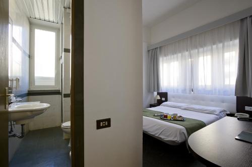 Letto o letti in una camera di Dipendenza Hotel Bellavista