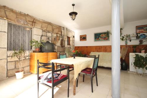 a dining room with a table and chairs at Apartments with a parking space Hvar - 8810 in Hvar