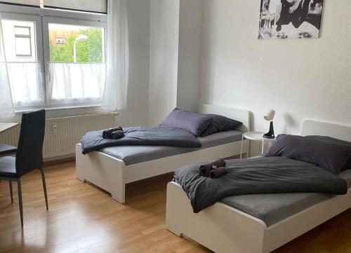 Postel nebo postele na pokoji v ubytování Cozy Apartments in Zwickau