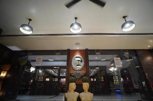 a store with two mannequins and a mirror in a building at Ambala Haveli in Ambāla
