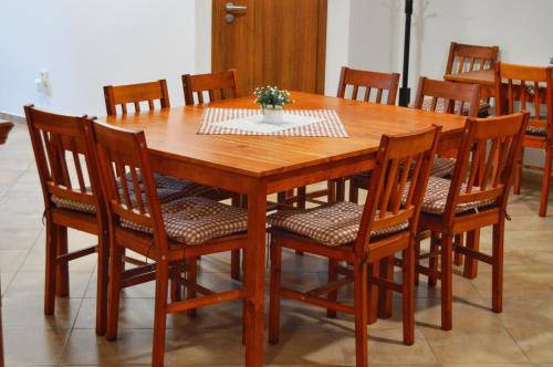 a wooden dining room table and chairs with a table and chairsuggest at Ubytování nad sklípkem v Šatově in Šatov