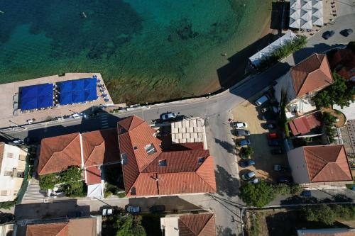 an overhead view of a house next to the beach at Hotel Miramare in Pylos