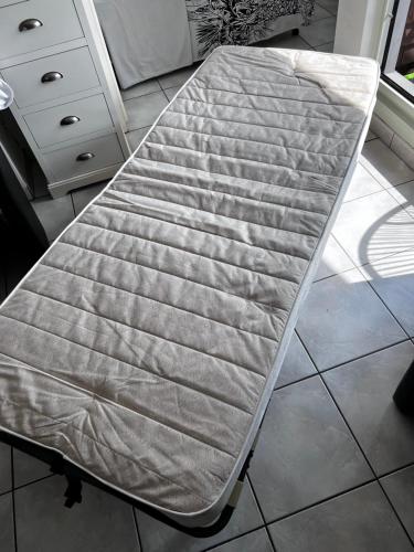 a mattress sitting on top of a kitchen floor at Beachfront Studio in Blankenberg (Belgium) in Blankenberge