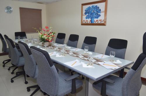 a conference room with a long table and chairs at Grand Regal Hotel Davao in Davao City