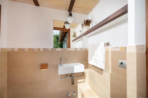 a bathroom with a sink and a shower at Can Sion in Esporles