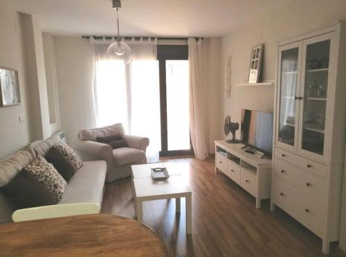 TV a/nebo společenská místnost v ubytování Apartamento La Montañesa en Aínsa, bonito apartamento con grande terraza