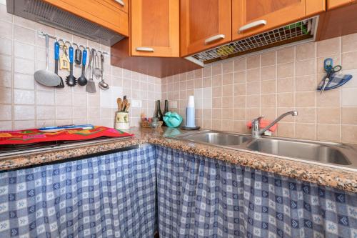 Kuchyň nebo kuchyňský kout v ubytování Casa Vacanze 21 Aprile - T